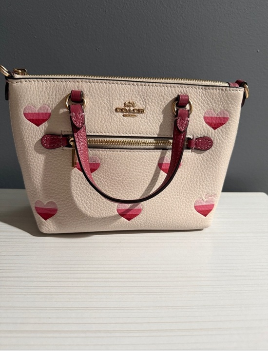 Handbags - Coach Mini Gallery Crossbody Bag in white with a stripe heart print.